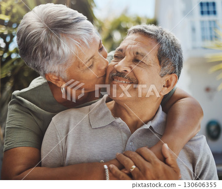 Black senior couple, hug and kiss for love, retirement holiday and happiness outdoor together. African man, woman kissing and happy quality time or marriage relationship bonding on travel vacation Black senior couple, hug and kiss for love, retirement holiday and happiness outdoor together. African man, woman kissing and happy quality time or marriage relationship bonding on travel vacation 130606355