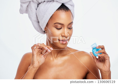Dental, floss and black woman face, flossing for teeth whitening, healthcare and hygiene isolated on white background. Oral care product, skincare and mouth cleaning for fresh breath in studio shot 130606519