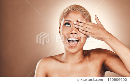 Crazy, skincare and black woman covering eye isolated on a brown background in a studio. Comic, beauty and model with hand to cover eyes for happiness, playful and comedy on a backdrop with mockup 130606600