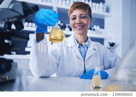 Science, beaker and black woman in laboratory with smile for research, medical study and experiment. Healthcare, biotechnology and female scientist with liquid, medicine and vaccine development Science, beaker and black woman in laboratory with smile for research, medical study and experiment. Healthcare, biotechnology and female scientist with liquid, medicine and vaccine development 130606602