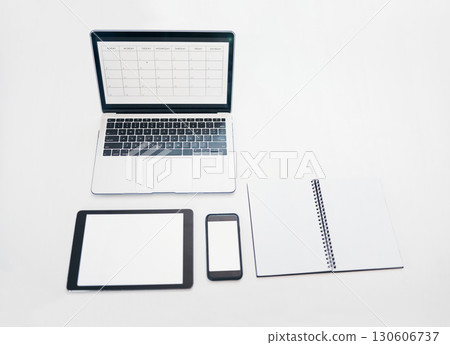 Laptop, tablet and phone mockup with notebook above for schedule planning, advertising or marketing. Computer, touchscreen and smartphone screen display for calendar reminder or organized workspace Laptop, tablet and phone mockup with notebook above for schedule planning, advertising or marketing. Computer, touchscreen and smartphone screen display for calendar reminder or organized workspace 130606737