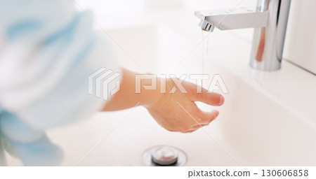 Cleaning, child and girl washing hands in the bathroom with soap for hygiene, healthcare and independence at home. Young, water and healthy kid doing sanitary routine at a sink for toxic bacteria 130606858