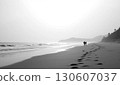 Back view of two people walking on the beach 130607037