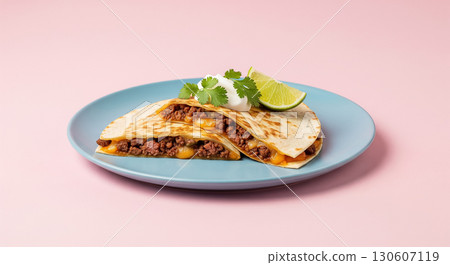 Beef Quesadilla with Sour Cream and Lime on Blue Plate 130607119