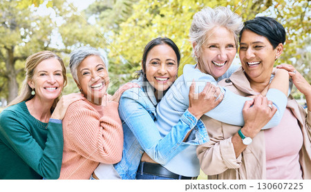 Friends, park and group of women hug enjoying bonding, quality time and relax in nature together. Diversity, friendship and portrait of happy senior females with smile, embrace and peace outdoors Friends, park and group of women hug enjoying bonding, quality time and relax in nature together. Diversity, friendship and portrait of happy senior females with smile, embrace and peace outdoors 130607225