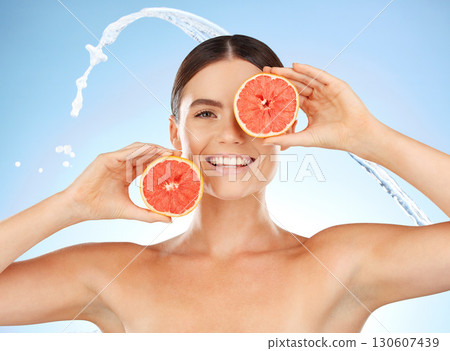 Beauty, water and portrait of happy woman with grapefruit for fruit detox, health wellness or natural facial skincare. Spa salon, cleaning and nutritionist model with food product for vitamin c glow Beauty, water and portrait of happy woman with grapefruit for fruit detox, health wellness or natural facial skincare. Spa salon, cleaning and nutritionist model with food product for vitamin c glow 130607439