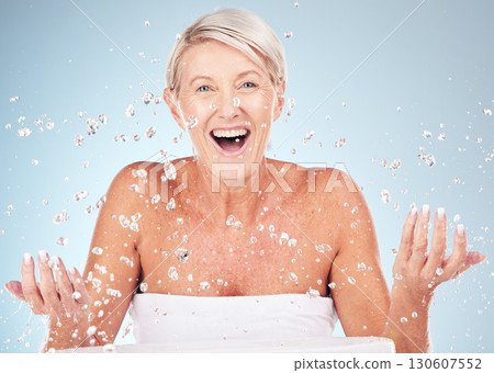 Shower, face and old woman excited with water drops, clean skin and antiaging skincare, elderly model isolated on studio background. Beauty, senior cosmetic care and facial portrait, wow and hygiene 130607552