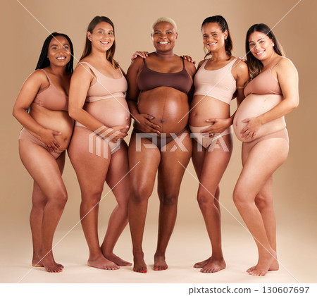 Pregnancy, diversity and portrait of friends in studio for community, motherhood and prenatal wellness. Maternity, love and pregnant women showing their baby bump stomach together by beige background 130607697