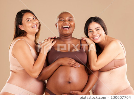 Portrait, beauty and body with pregnant friends in studio on a beige background for diversity or motherhood. Family, love and pregnancy with a woman friend group showing their baby bump stomach 130607704