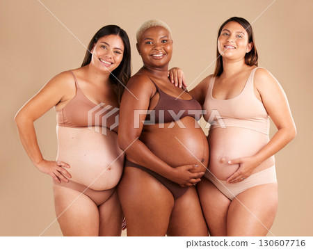 Portrait, beauty and tummy with pregnant friends in studio on a beige background for diversity or motherhood. Family, love and pregnancy with a woman friend group showing their baby bump stomach 130607716