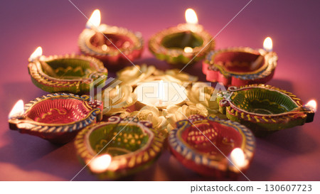 lighting candles for Diwali celebration lighting candles for Diwali celebration 130607723