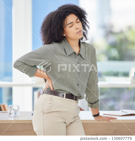 Business, back pain and black woman with stress, burnout and fatigue in office, muscle strain and overworked. African American female employee, entrepreneur or leader with healthcare issue and injury 130607779