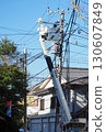 High-altitude work: electric pole and wire construction 130607849