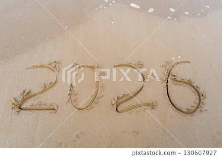 2026 numbers written in the sandy beach 130607927