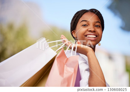 Black woman, shopping and bags for luxury, thinking and purchase in city, smile and customer. African American female client, lady and shopper with boutique clothes, expensive brands and outdoor 130608025