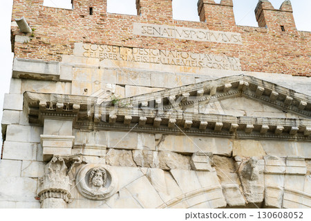 Triumphal Arch of Augustus. Rimini old Italian city center landmark. House square tower. Italy. 130608052