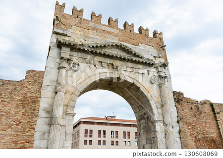 Triumphal Arch of Augustus. Rimini old Italian city center landmark. House square tower. Italy 130608069