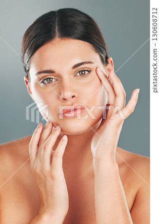 Skincare, beauty wellness and portrait of woman on gray background for cosmetics, facial treatment and spa. Dermatology, aesthetic and face of girl with glowing, healthy and natural skin in studio Skincare, beauty wellness and portrait of woman on gray background for cosmetics, facial treatment and spa. Dermatology, aesthetic and face of girl with glowing, healthy and natural skin in studio 130608712