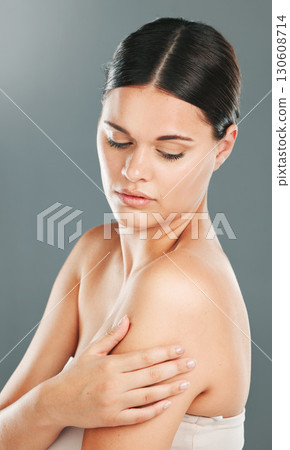 Skincare, woman and cosmetics for dermatology, natural beauty or confident girl on grey studio background. Female, lady or treatment for body care, luxury or grooming routine for healthy or soft skin Skincare, woman and cosmetics for dermatology, natural beauty or confident girl on grey studio background. Female, lady or treatment for body care, luxury or grooming routine for healthy or soft skin 130608714