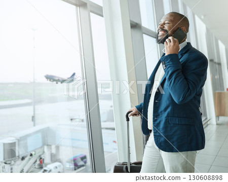 Businessman, phone call and waiting at airport for travel, work trip or plain journey with luggage to country. Happy black man employee or person smile for communication before flight on smartphone Businessman, phone call and waiting at airport for travel, work trip or plain journey with luggage to country. Happy black man employee or person smile for communication before flight on smartphone 130608898