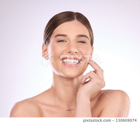 Beauty, woman and portrait in studio for skincare, dermatology and wellness cosmetics on background. Happy female model, smile and aesthetic glow of shine, laser transformation and facial spa results Beauty, woman and portrait in studio for skincare, dermatology and wellness cosmetics on background. Happy female model, smile and aesthetic glow of shine, laser transformation and facial spa results 130609074