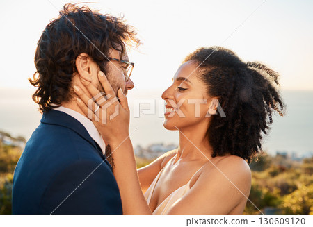 Married couple, smile and love for embrace, care or marriage in bonding relationship in the nature outdoors. Happy bride and groom smiling in joyful happiness for affection, compassion and romance 130609120