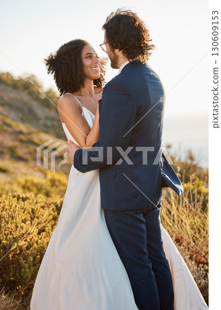 Wedding couple, interracial and hug in nature, happy and excited while celebrating love, beginning and romance. Romantic, marriage and black woman bride with groom embrace, cheerful and smile Wedding couple, interracial and hug in nature, happy and excited while celebrating love, beginning and romance. Romantic, marriage and black woman bride with groom embrace, cheerful and smile 130609153