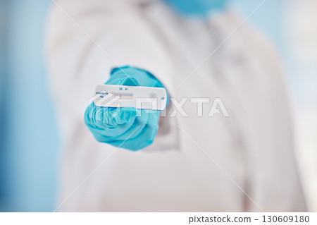 Doctor, hand and covid 19 test results in laboratory, hospital and gloves for safety, health and protection at work. Professional medic, diagnosis and help for healthcare, wellness and medical advice 130609180