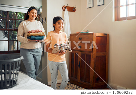 Cleaning, child and mother doing laundry clothes, house work and fold clean fabric, cotton or linen. Love bond, walking and happy family kid and mom with fresh shirt and doing domestic housekeeping Cleaning, child and mother doing laundry clothes, house work and fold clean fabric, cotton or linen. Love bond, walking and happy family kid and mom with fresh shirt and doing domestic housekeeping 130609282