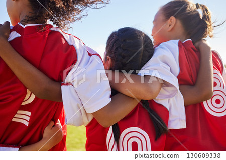 Girl, soccer group and back with huddle on field for match, contest or game with team building support. Female kids, football player children and hug for solidarity, diversity or motivation on pitch 130609338
