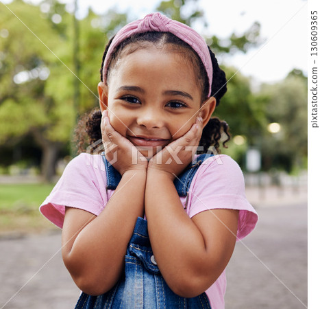 Cute little girl, face and portrait smile in adorable pink casual fashion with denim at the outdoor park. Happy girly child smiling in happiness with innocent expression for holiday break in nature 130609365