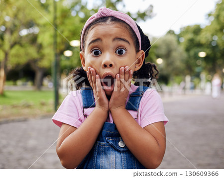 Wow, surprise and girl child at park outdoors looking shocked. Face portrait, omg and shock of kid from South Africa with surprised facial expression after good news while on holiday or vacation. 130609366