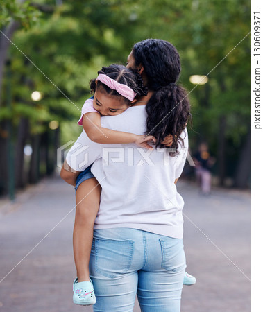 Love, family and mother carrying girl outdoors, bonding and hugging. Motherhood support, care and woman embrace, hug or cuddle with sleeping daughter or kid and enjoying quality time together at park Love, family and mother carrying girl outdoors, bonding and hugging. Motherhood support, care and woman embrace, hug or cuddle with sleeping daughter or kid and enjoying quality time together at park 130609371