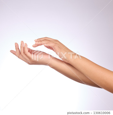 Hands, skin and beauty, skincare and woman, manicure and nail polish with cosmetics on studio background. Sunscreen, moisturizer application and dermatology with lotion cosmetic product and female 130610006