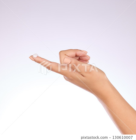 Hand, cream and beauty, skincare and woman, manicure and nail polish with cosmetics on studio background. Sunscreen, moisturizer application and dermatology with lotion cosmetic product and female 130610007