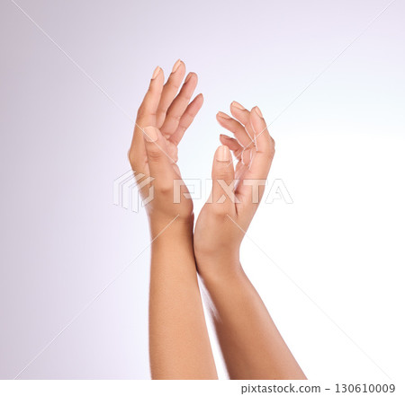 Hands, nails and beauty, woman with nail polish, manicure and makeup with cosmetics on studio background. Skincare, moisturizer with mockup and dermatology with lotion cosmetic product and female 130610009