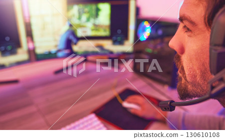 Computer gamer, man and face with headphones for esports, online games or virtual competition in dark room. Gaming guy, video game player and live streaming on headset in neon lighting, tech or night Computer gamer, man and face with headphones for esports, online games or virtual competition in dark room. Gaming guy, video game player and live streaming on headset in neon lighting, tech or night 130610108