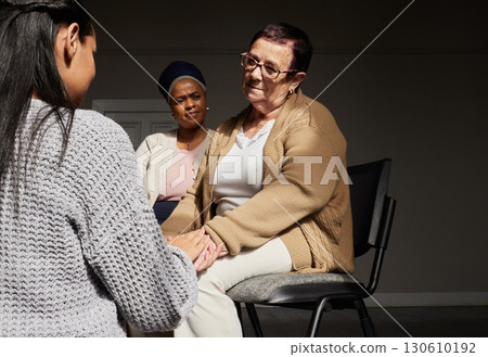 Support, women holding hands and group therapy with understanding, sharing feelings and trust talking in session. Mental health, grief or depression, sad senior woman with therapist sitting together. Support, women holding hands and group therapy with understanding, sharing feelings and trust talking in session. Mental health, grief or depression, sad senior woman with therapist sitting together. 130610192