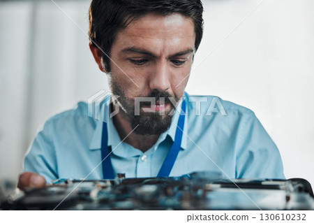 Information technology face, laptop circuit or man repair motherboard hardware, electronics or semiconductor. CPU system maintenance, service industry and IT specialist fixing microchip in tech lab 130610232