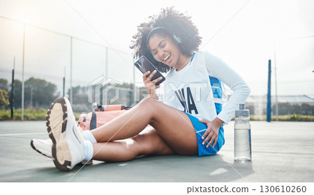 Netball sports, smartphone music and black woman listening to mp3 radio, audio podcast or media song. Laughing, online digital headphones and athlete streaming funny meme video after training workout 130610260