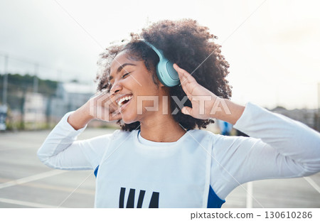 Fitness, freedom and music for black woman training at court, happy and relax with wellness track. Sports, podcast and girl smile with radio, playlist or song during exercise and workout Fitness, freedom and music for black woman training at court, happy and relax with wellness track. Sports, podcast and girl smile with radio, playlist or song during exercise and workout 130610286