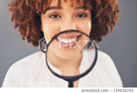 Beauty, magnifying glass and portrait with a black woman in studio to examine or check a skin routine. Wellness, investigation or skincare with an attractive young female searching her face for acne Beauty, magnifying glass and portrait with a black woman in studio to examine or check a skin routine. Wellness, investigation or skincare with an attractive young female searching her face for acne 130610291