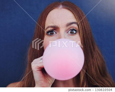 Closeup portrait, girl and bubblegum by wall, outdoor and urban adventure for funny, comic face and happy. Gen z woman, city and blue background with pink chewing gum, bubble and blowing for fun game Closeup portrait, girl and bubblegum by wall, outdoor and urban adventure for funny, comic face and happy. Gen z woman, city and blue background with pink chewing gum, bubble and blowing for fun game 130610504