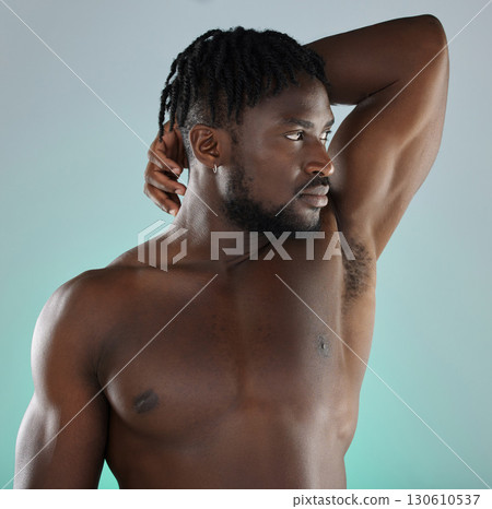 Beauty, health and man with armpit skincare hygiene or grooming isolated against a studio background. Natural, cosmetics and body care for healthy skin by a young, confident and African model 130610537