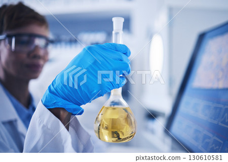 Science, liquid and beaker in hand of woman in laboratory for research, medical exam and pharmaceutical. Healthcare, biotechnology and scientist with vial for medicine, vaccine development and sample Science, liquid and beaker in hand of woman in laboratory for research, medical exam and pharmaceutical. Healthcare, biotechnology and scientist with vial for medicine, vaccine development and sample 130610581