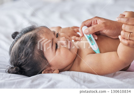 Thermometer, sick and baby on bad with fever, cold and flu symptoms in bedroom with tool to check temperature. Family, child care and parent with sad newborn kid testing for ill, virus or infection 130610834