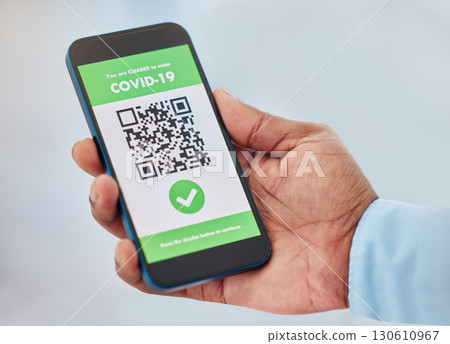 Covid, vaccination and mobile certificate for travel, trip or medical certification on a phone. Technology, healthcare and closeup of hand with app for coronavirus with barcode for immunity vaccine. 130610967