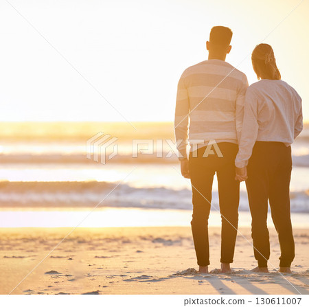 Couple, beach and holding hands at sunset for love and peace with a calm ocean on vacation. Young man and woman together on holiday at sea to relax, travel and connect in nature for freedom mockup Couple, beach and holding hands at sunset for love and peace with a calm ocean on vacation. Young man and woman together on holiday at sea to relax, travel and connect in nature for freedom mockup 130611007