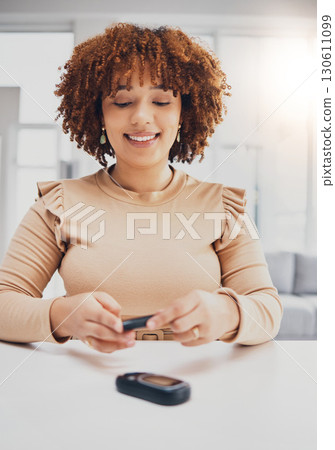 Health, diabetes and black woman with blood sugar test on finger, wellness and digital device. African American female, lady and machine to check glucose level, happiness and technology for self care 130611099