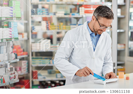 Pharmacist man, store and counting with pills, medicine and focus for health, product or sales. Medical professional, pharma expert or sorting medication in pharmacy for wellness, healthcare and job 130611138